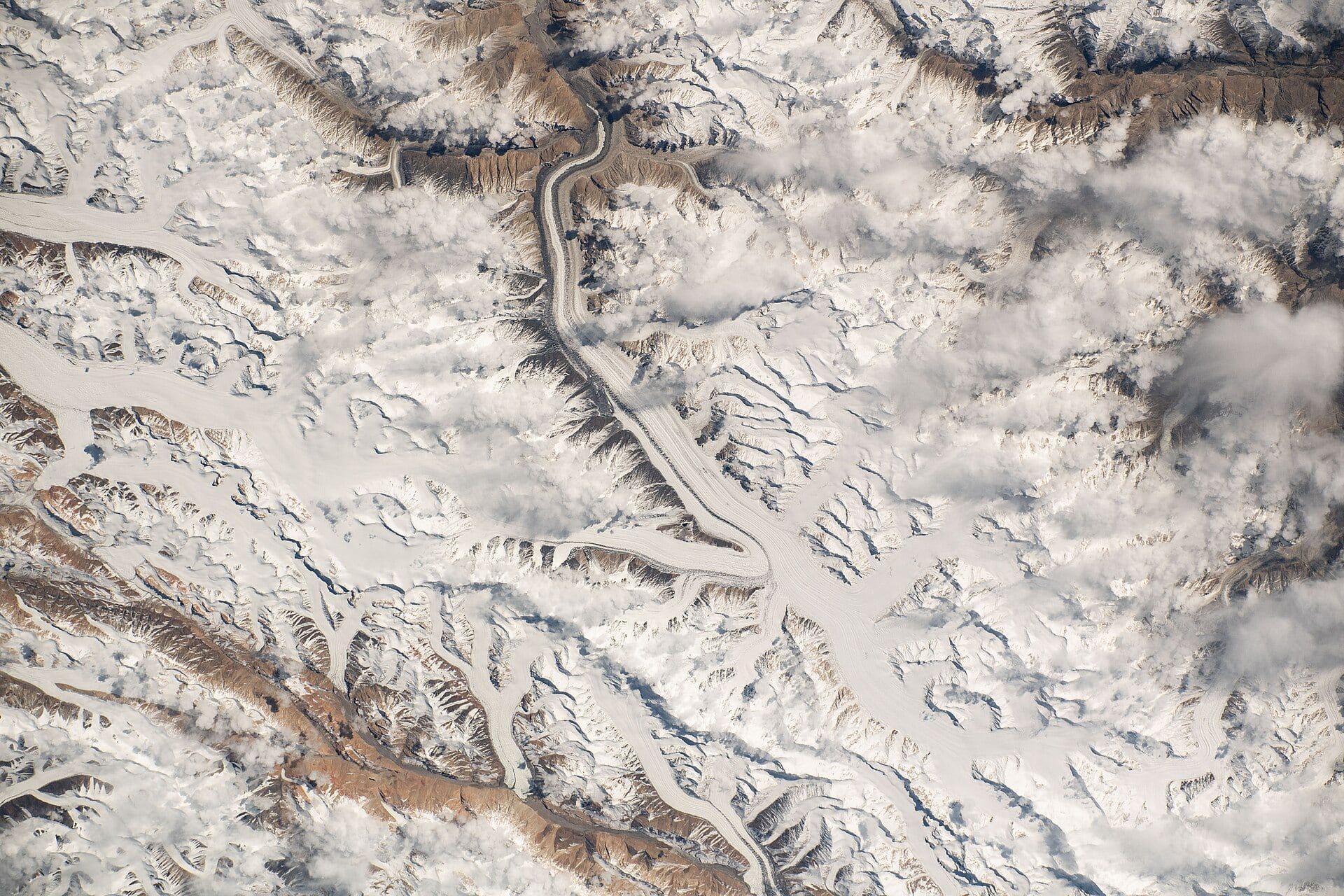 Glaciers threading between snow-covered peaks of the Karakoram, photographed from the International Space Station